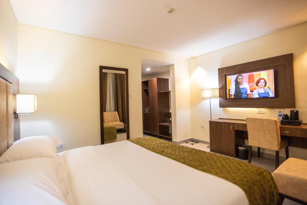 Ένα ή περισσότερα κρεβάτια σε δωμάτιο στο Jogor Hotel Ibadan