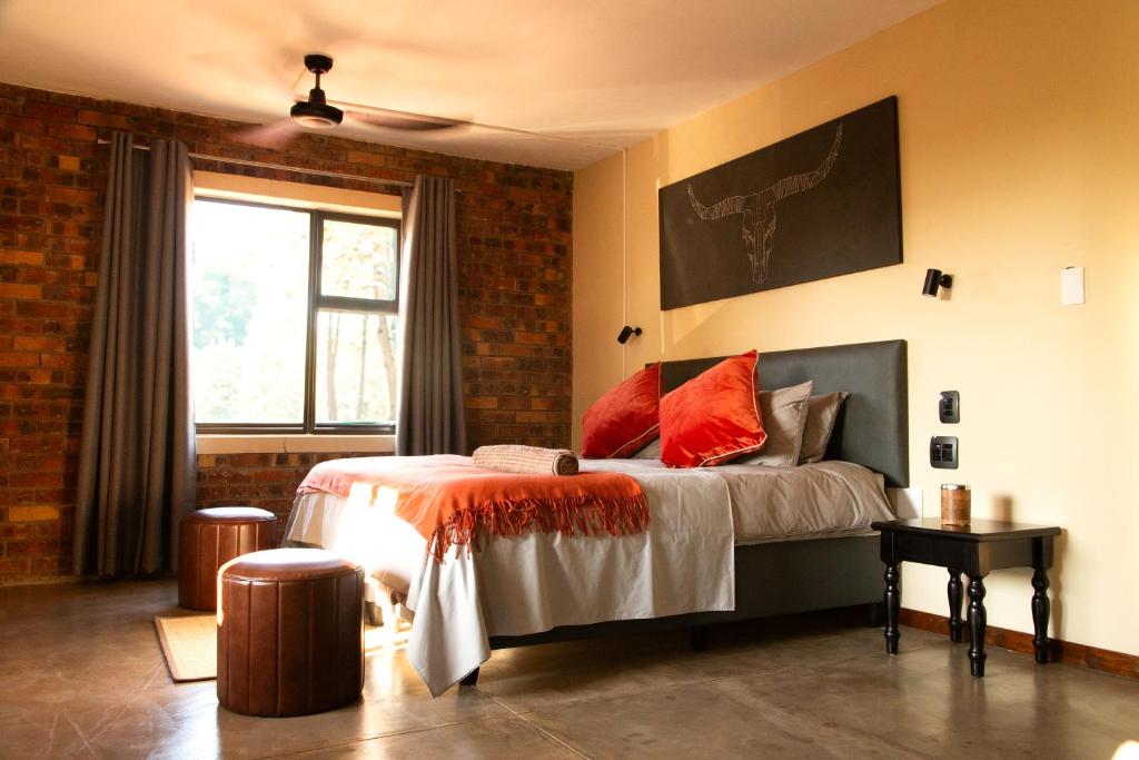 A bed or beds in a room at Melamar Estate