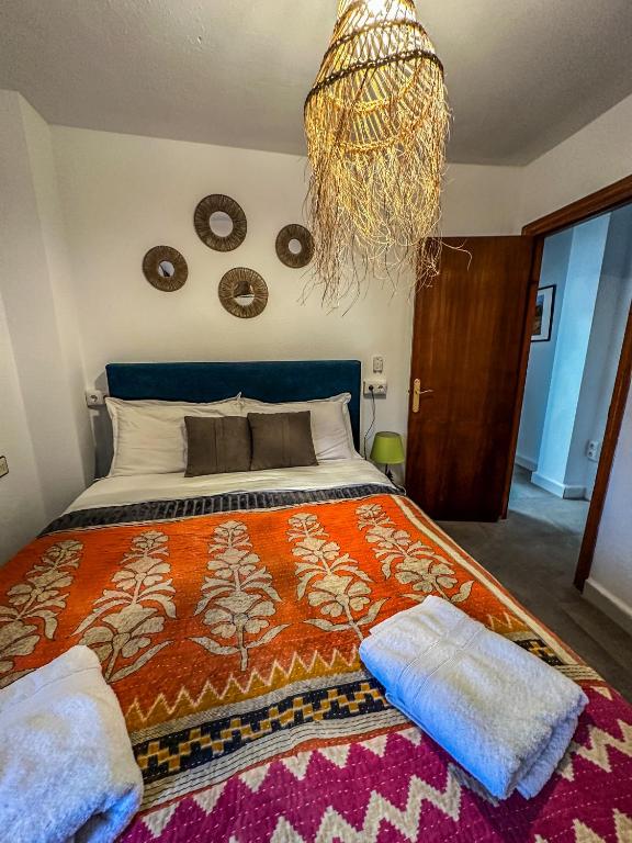 Posteľ alebo postele v izbe v ubytovaní Pisos Baza, Tres apartmentos en Baza Central