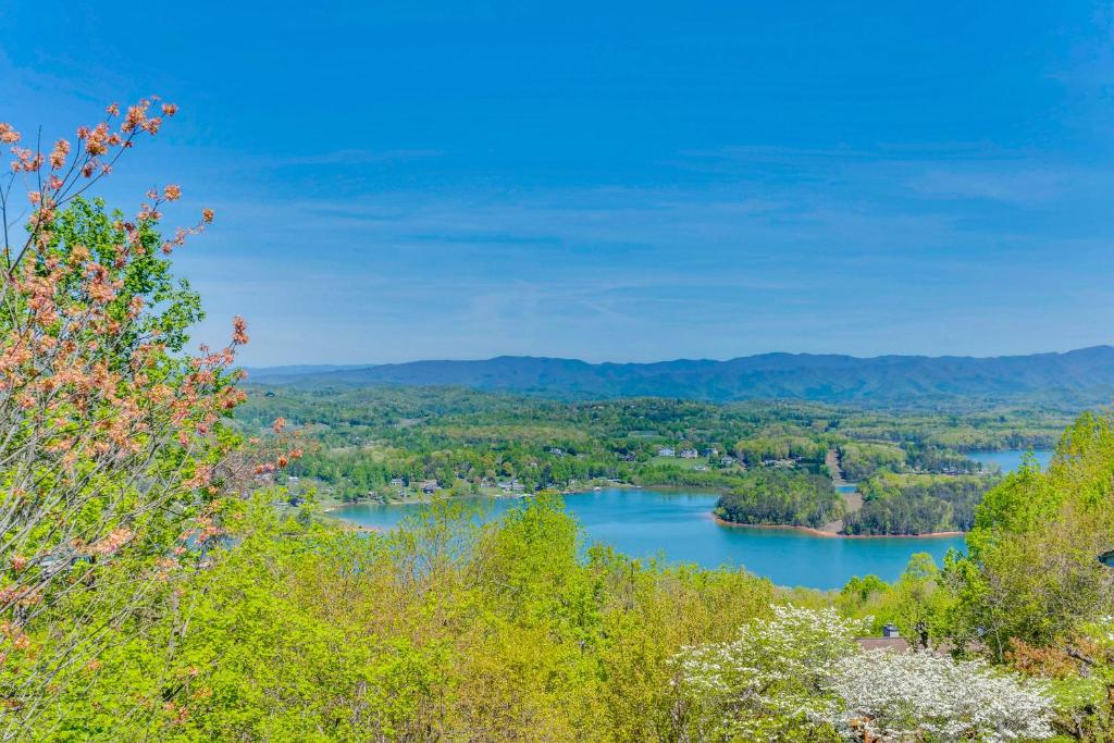 a view of a river with trees and mountains at Lake-View Condo with Covered Deck in Hiawassee! in Hiawassee