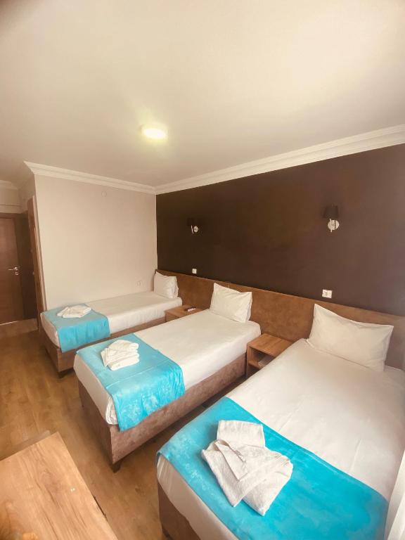 Postel nebo postele na pokoji v ubytování Malkoç Hotel