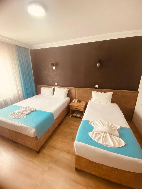 Postel nebo postele na pokoji v ubytování Malkoç Hotel
