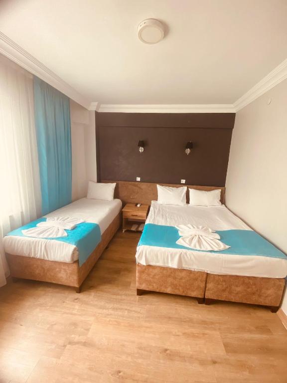 Postel nebo postele na pokoji v ubytování Malkoç Hotel