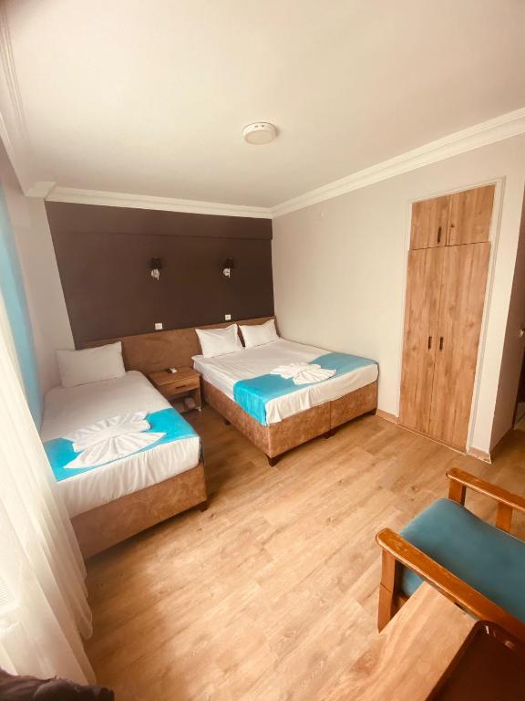 Postel nebo postele na pokoji v ubytování Malkoç Hotel