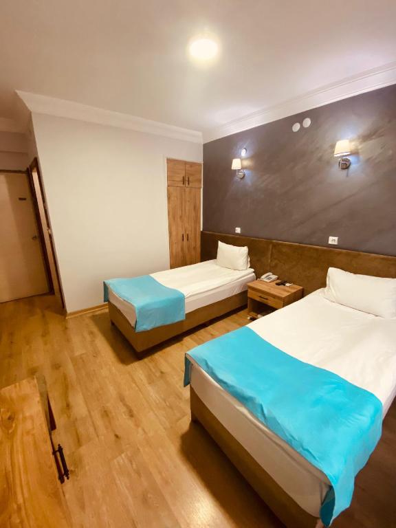 Postel nebo postele na pokoji v ubytování Malkoç Hotel