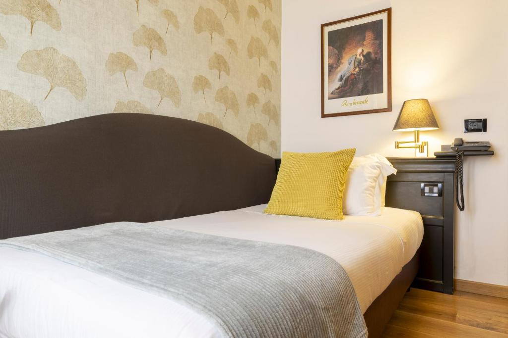 Postel nebo postele na pokoji v ubytování Hotel Bagliori