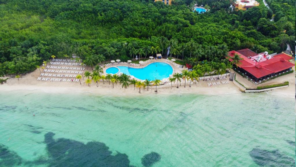an aerial view of a resort on a beach at Occidental Cozumel - All Inclusive in Cozumel