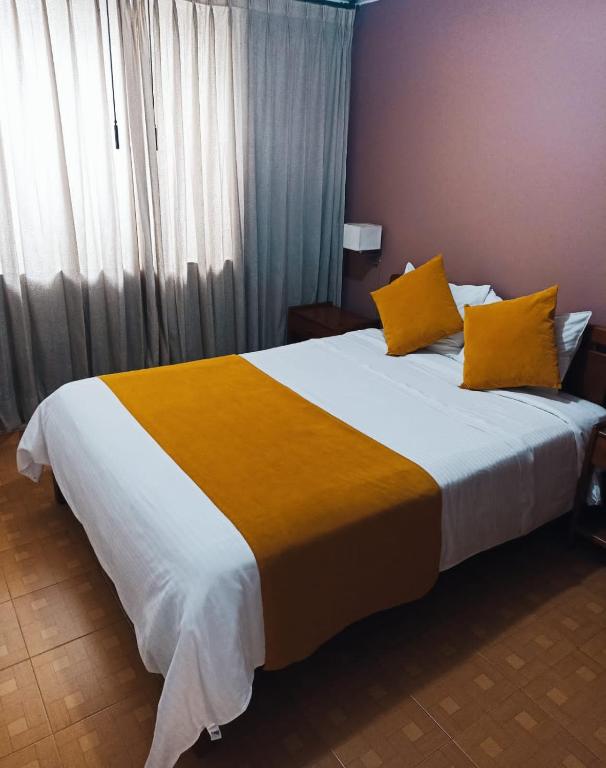 Postel nebo postele na pokoji v ubytování Hotel Tuvalu