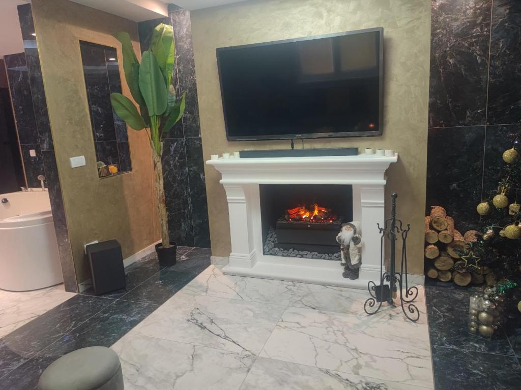 TV a/nebo společenská místnost v ubytování Nirvana SPA Center