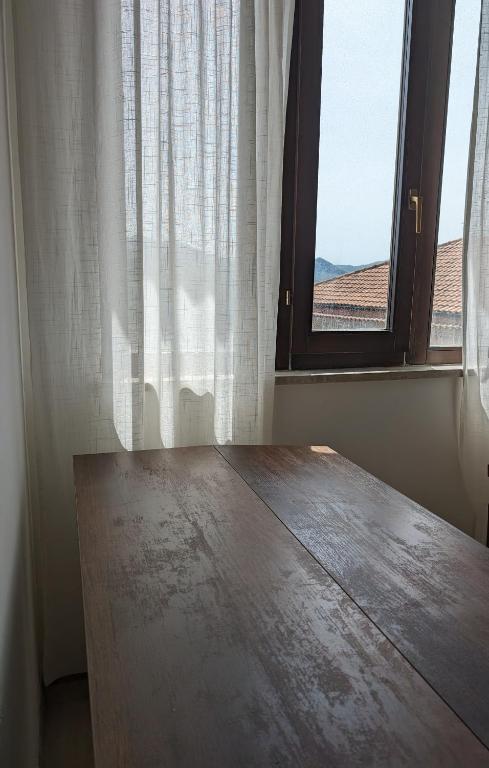 Postel nebo postele na pokoji v ubytování CAPORELLA Dimora della via Appia