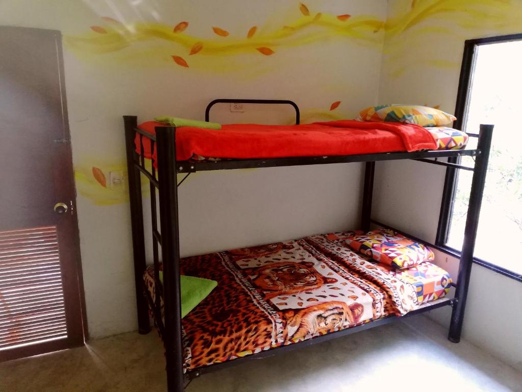 Postel nebo postele na pokoji v ubytování Hospedaje Pa'Gaïa