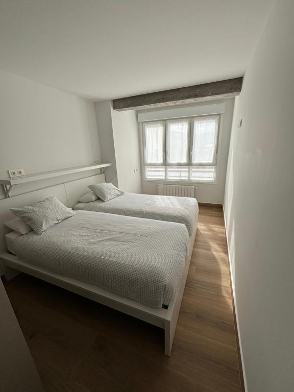Postel nebo postele na pokoji v ubytování Apartamento Elkano 1
