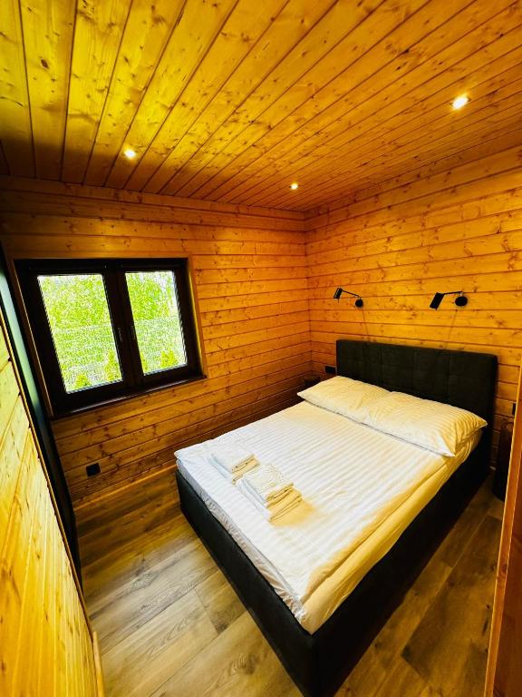 Łóżko lub łóżka w pokoju w obiekcie Kamienica House 9