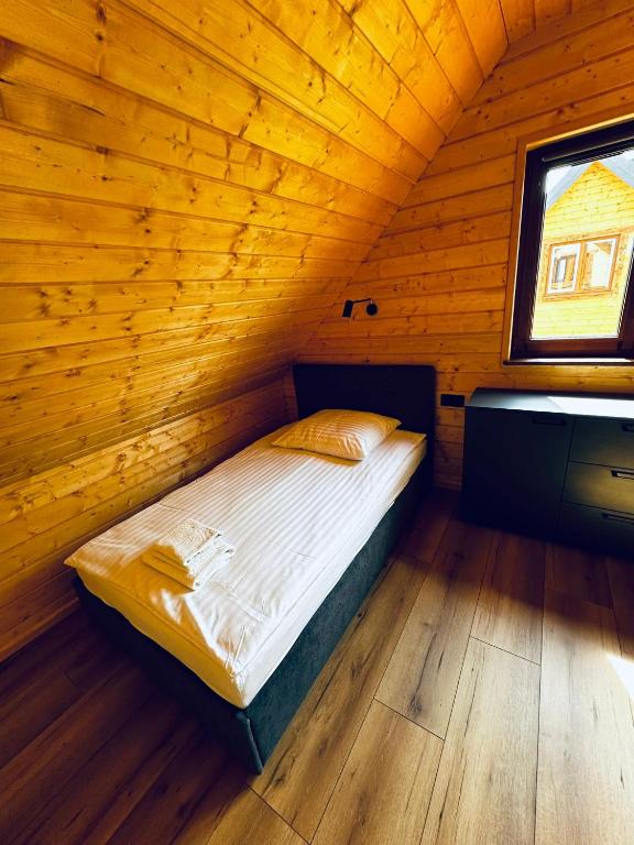 Łóżko lub łóżka w pokoju w obiekcie Kamienica House 9