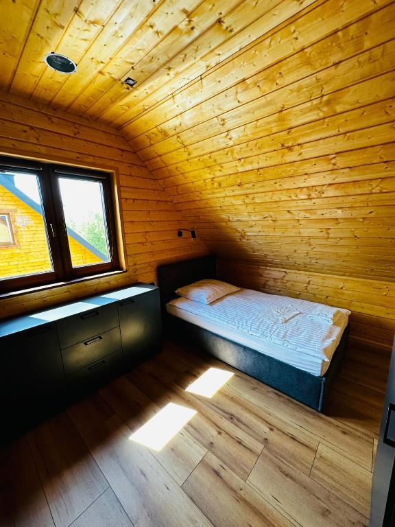 Łóżko lub łóżka w pokoju w obiekcie Kamienica House 9