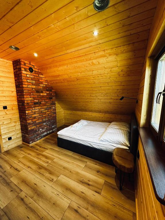 Łóżko lub łóżka w pokoju w obiekcie Kamienica House 9