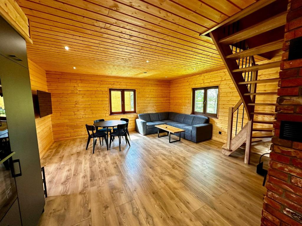 Łóżko lub łóżka w pokoju w obiekcie Kamienica House 9