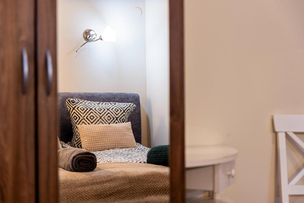 Postel nebo postele na pokoji v ubytování Urban Rooms
