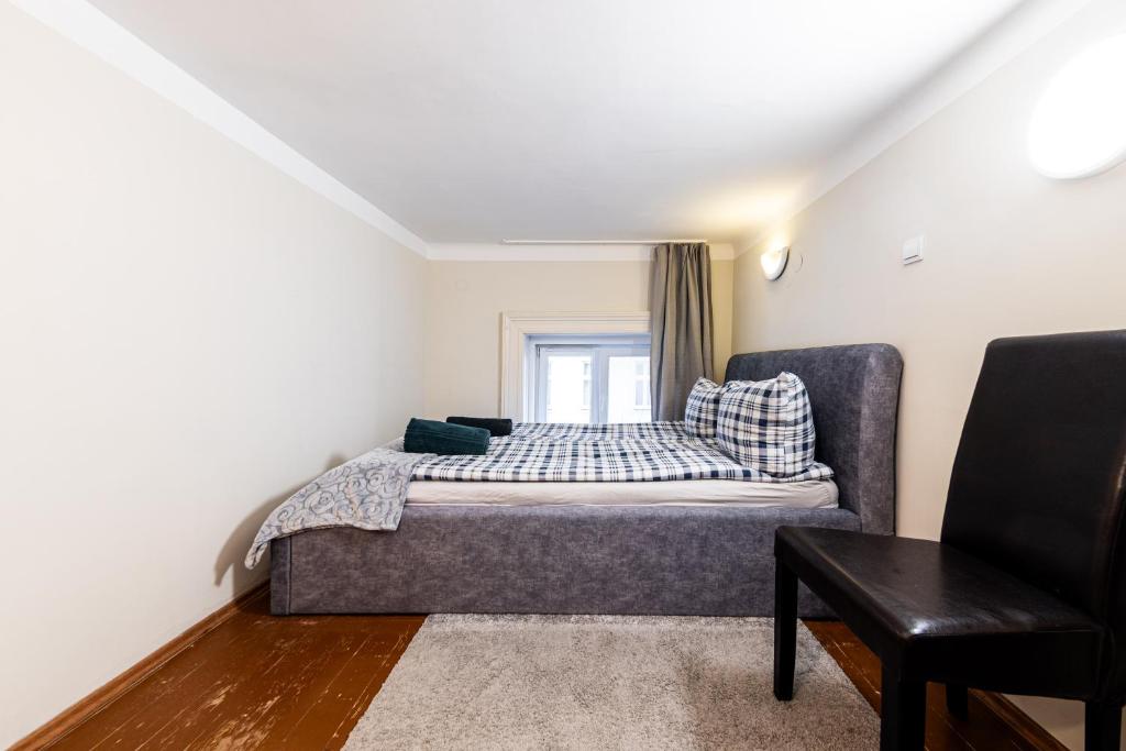 Postel nebo postele na pokoji v ubytování Urban Rooms