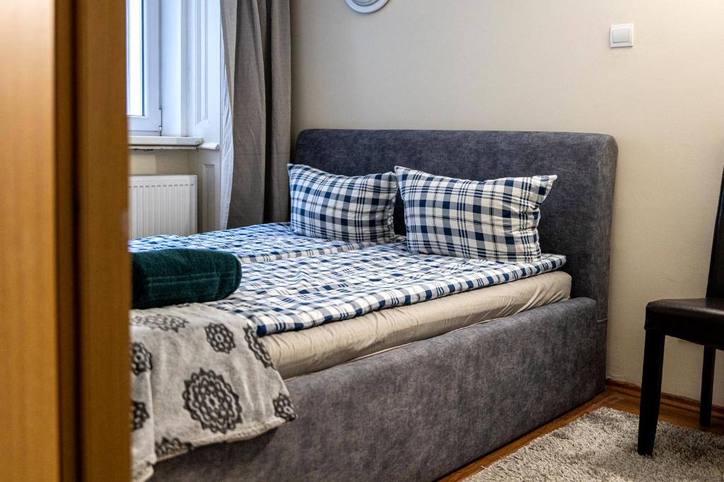 Postel nebo postele na pokoji v ubytování Urban Rooms
