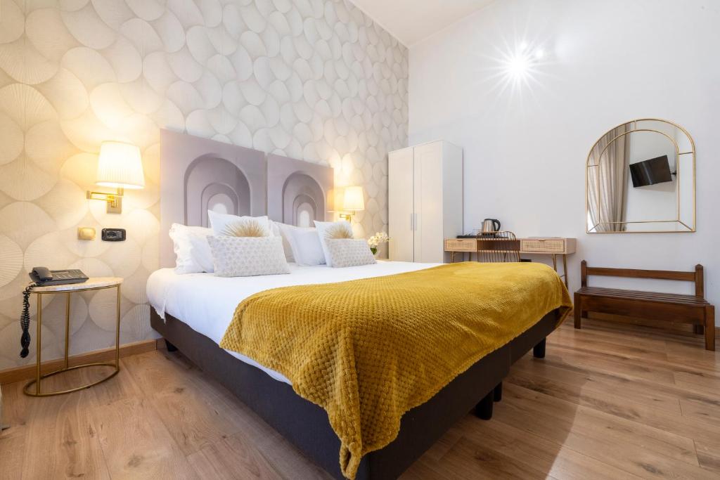 Postel nebo postele na pokoji v ubytování Hotel Bagliori