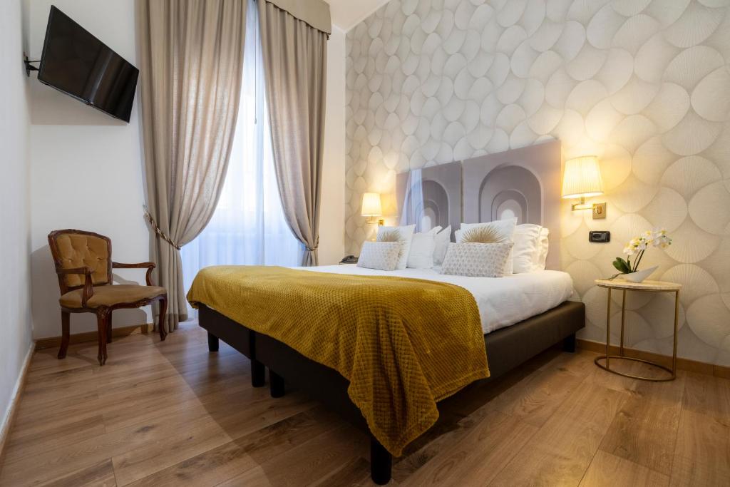 Postel nebo postele na pokoji v ubytování Hotel Bagliori