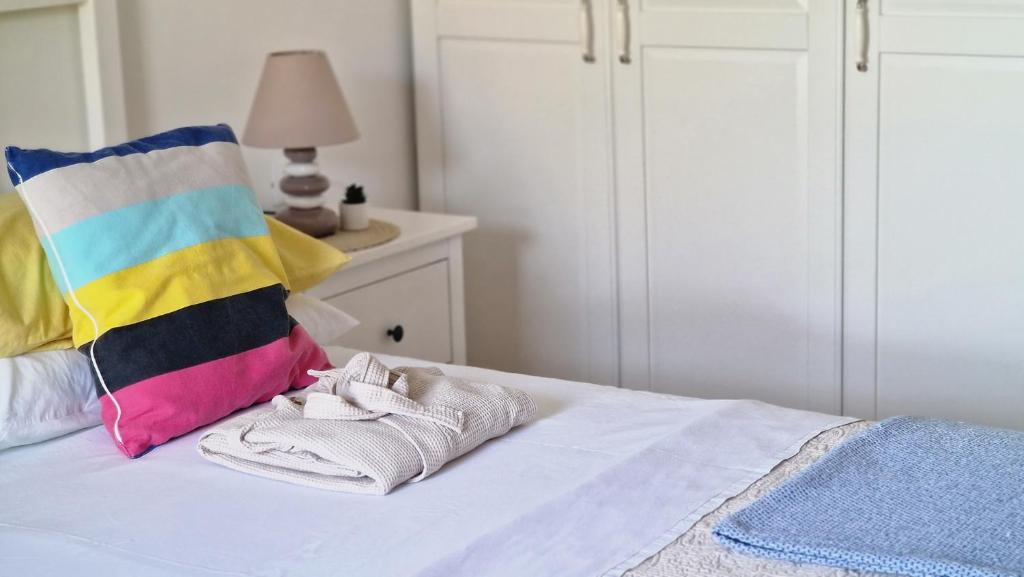 Postel nebo postele na pokoji v ubytování Cappelli Apartments - Lošinj