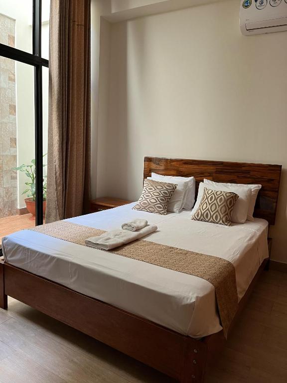 Postel nebo postele na pokoji v ubytování Studio 69 Aparthotel