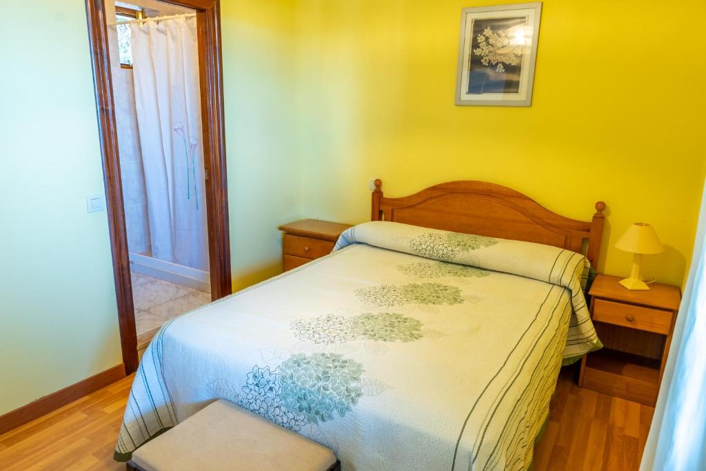 Postel nebo postele na pokoji v ubytování APARTAMENTOS OLGA