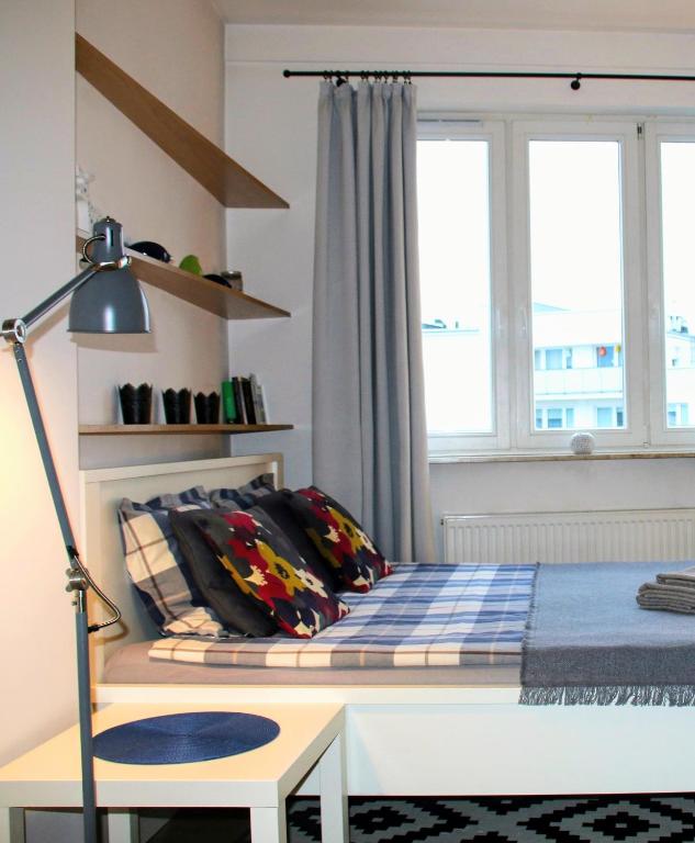 Posteľ alebo postele v izbe v ubytovaní Apartament blisko Centrum