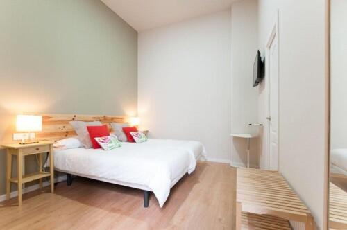 Postel nebo postele na pokoji v ubytování Triana 103 Rooms & Suites
