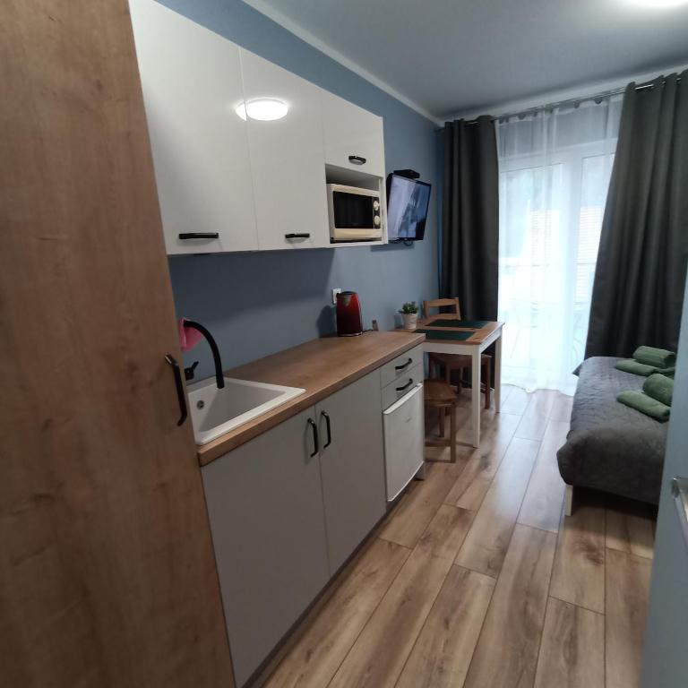 Kuchyňa alebo kuchynka v ubytovaní Apartamenty Gościnne Idylla