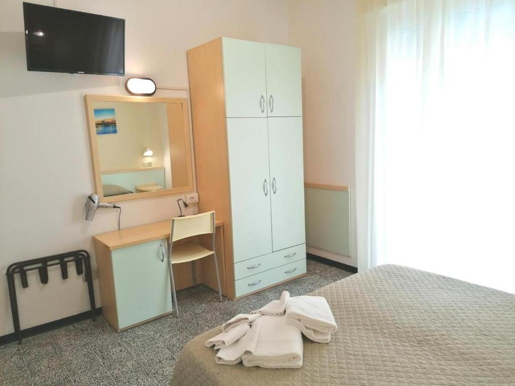 Postel nebo postele na pokoji v ubytování Hotel Arno