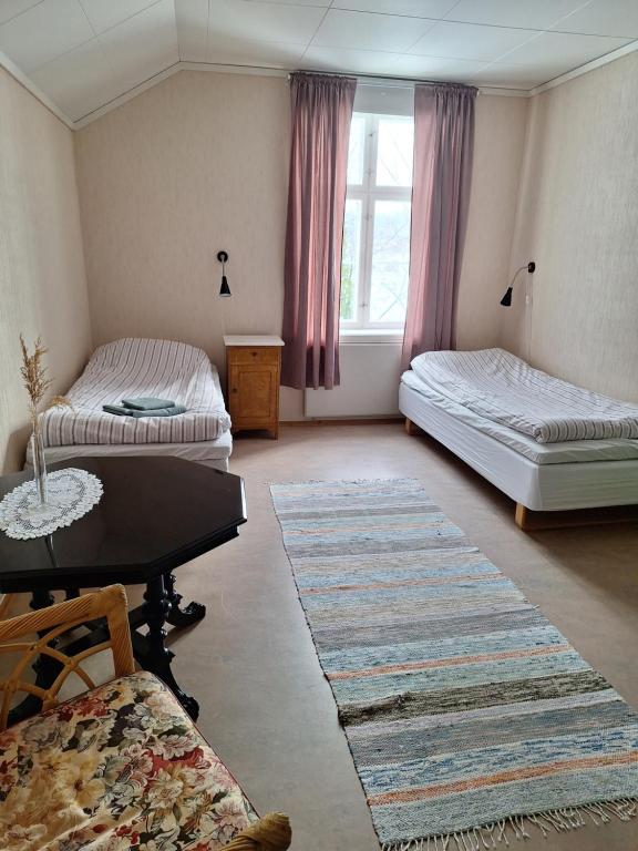 Postel nebo postele na pokoji v ubytování Hurdal Gjestegård