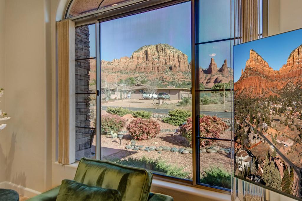 a room with a window with views of the desert at Sedona Chapel Area Charm Red Rock Views, Outdoor Dining, Near Hiking, Pets OK in Sedona