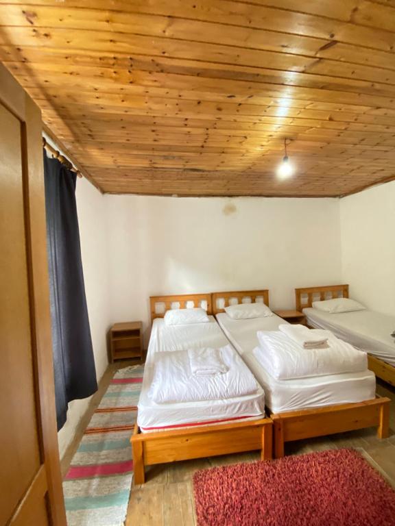 Postel nebo postele na pokoji v ubytování Rupa Guest House