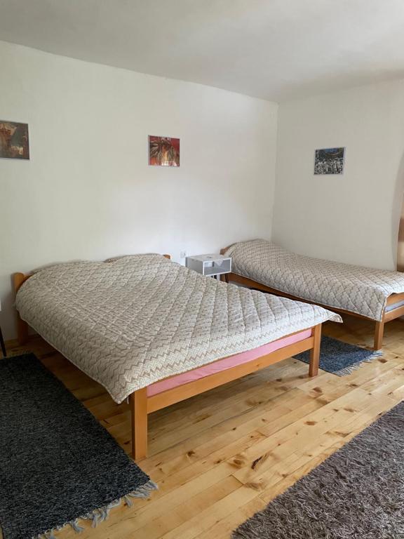 Postel nebo postele na pokoji v ubytování Apartmani Nikola Dojkinci
