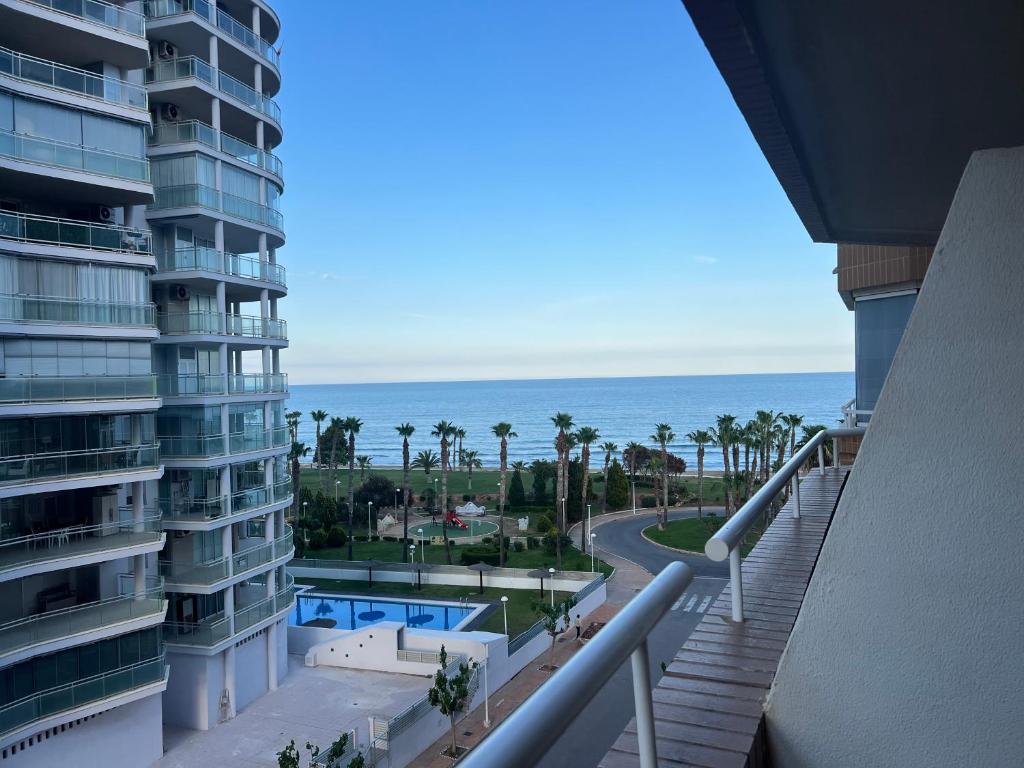 a view of the ocean from the balcony of a building at Costa Marina III - 1ª línea de playa in El Borseral