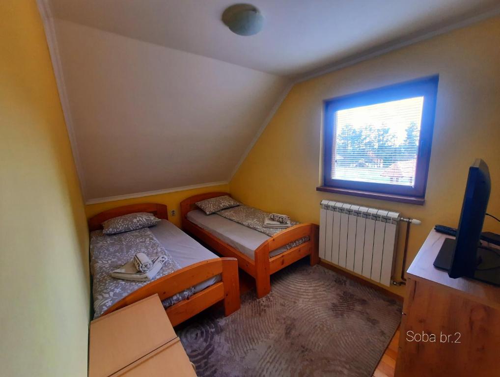 Postel nebo postele na pokoji v ubytování Vilotijevic - Tara Centar