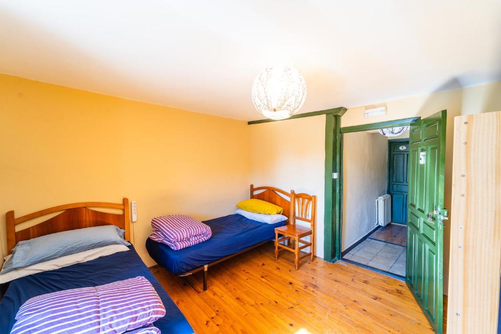 Postel nebo postele na pokoji v ubytování Hostel Atapuerca INpulso