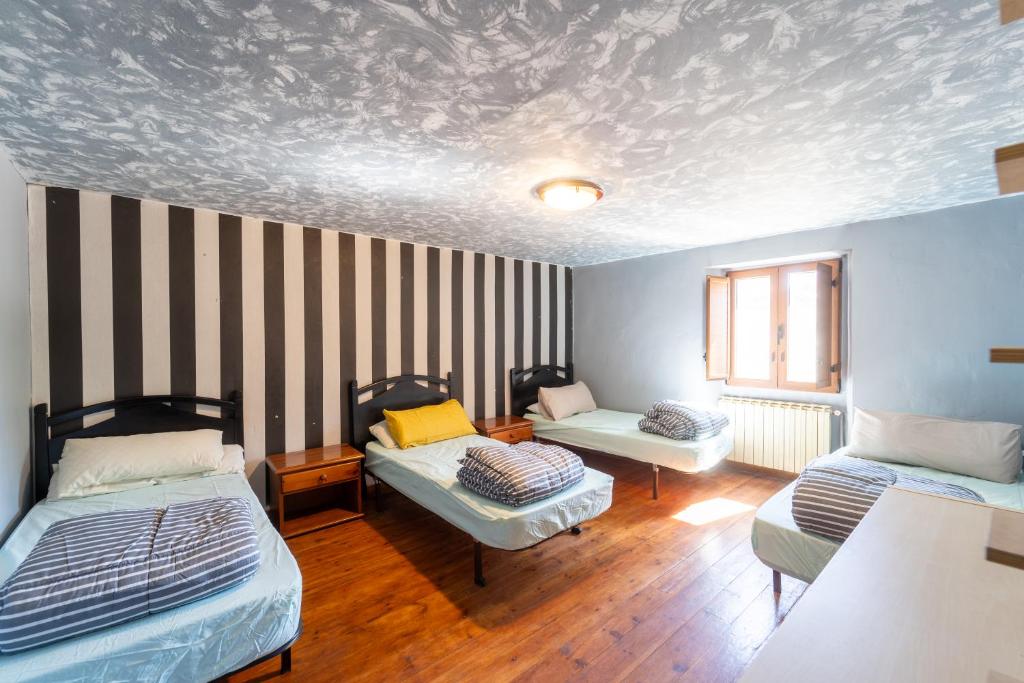 Postel nebo postele na pokoji v ubytování Hostel Atapuerca INpulso