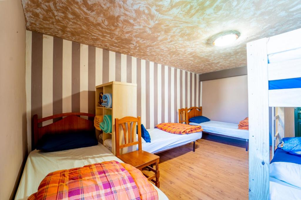Postel nebo postele na pokoji v ubytování Hostel Atapuerca INpulso