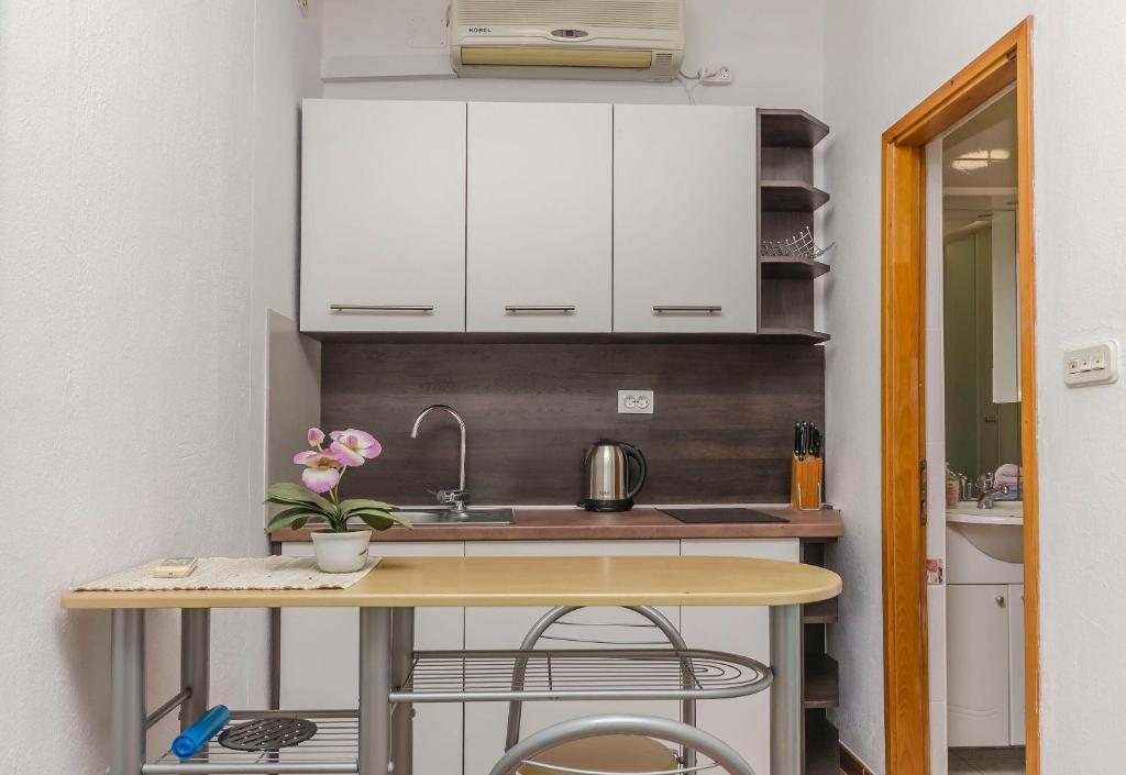 Kuchyň nebo kuchyňský kout v ubytování Apartments Sweet Escape