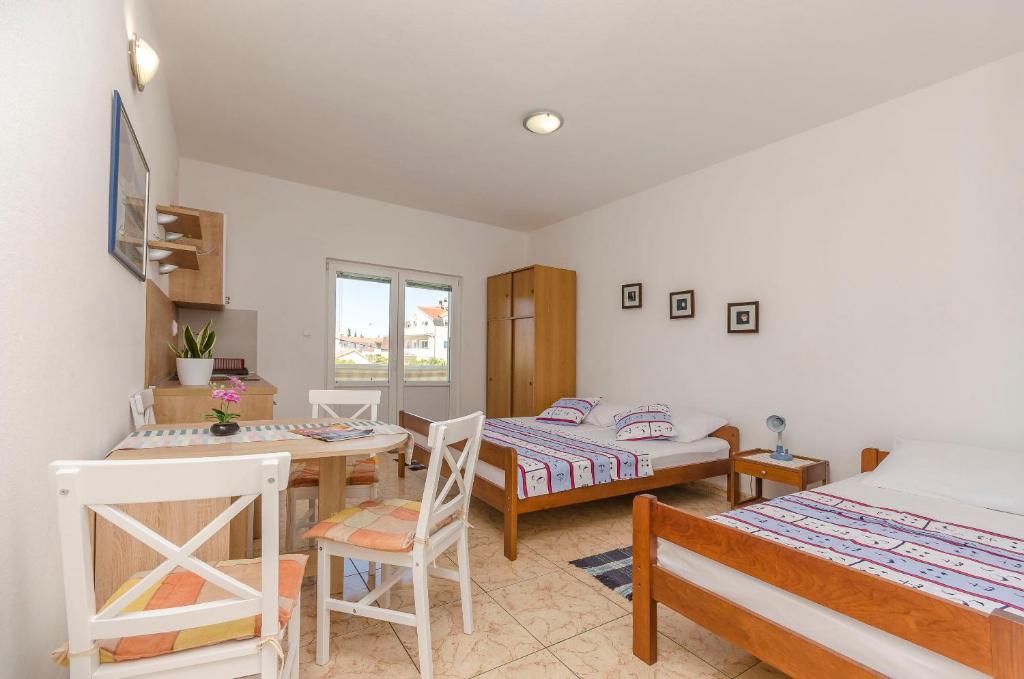 Postel nebo postele na pokoji v ubytování Apartments Sweet Escape