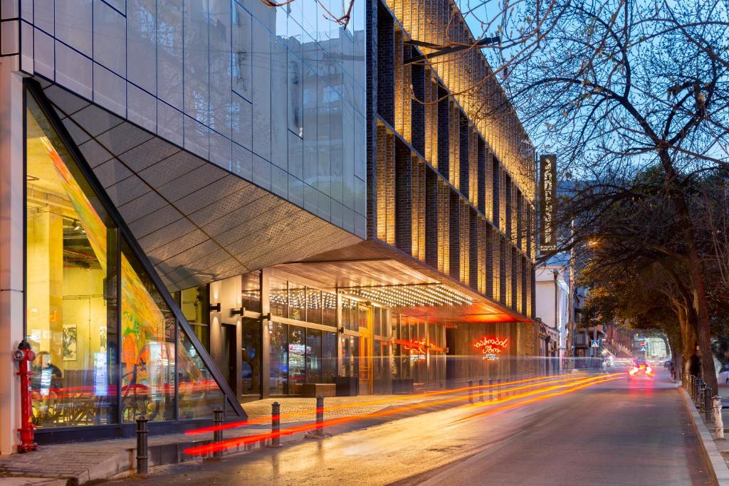 a city street with a large building on the side at Artizan - Design Hotel in Tbilisi City