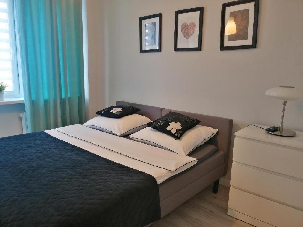 Ένα ή περισσότερα κρεβάτια σε δωμάτιο στο Apartament Classic Południe