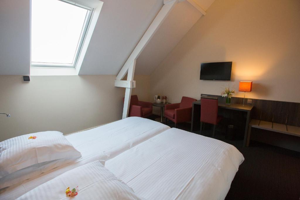 Postel nebo postele na pokoji v ubytování Albion Hotel