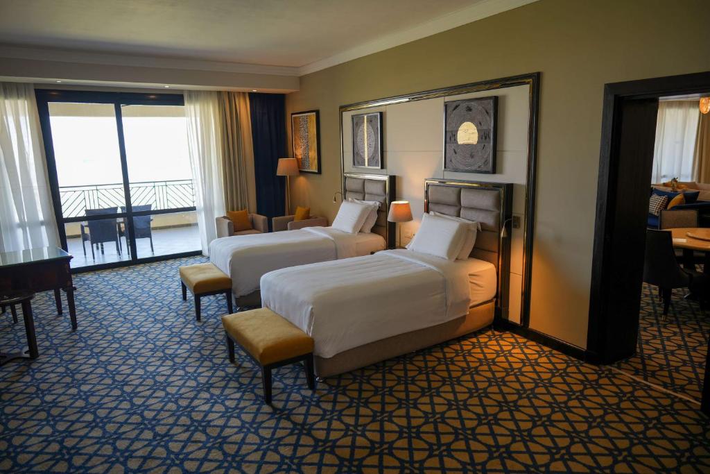 A bed or beds in a room at Radisson Blu Hotel & Convention Center, Alexandria