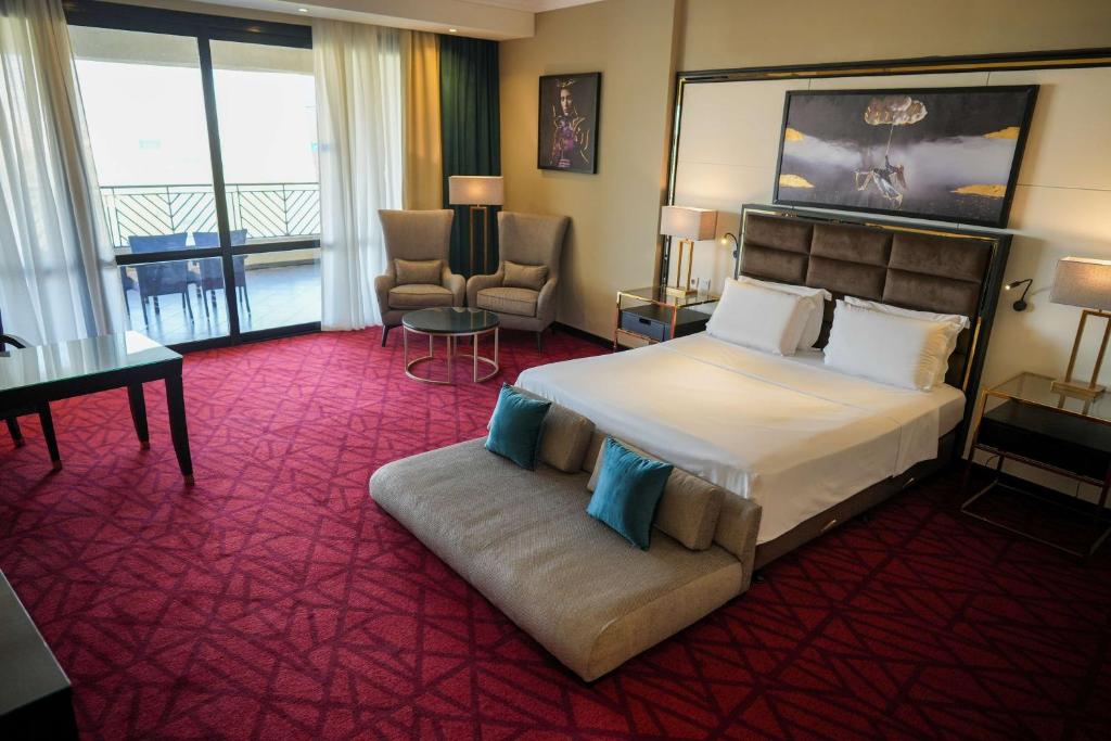 A bed or beds in a room at Radisson Blu Hotel & Convention Center, Alexandria