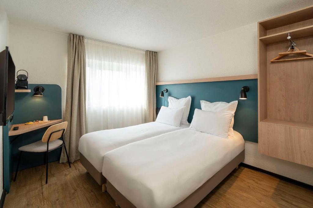 Postel nebo postele na pokoji v ubytování Le Carline, Sure Hotel Collection by Best Western